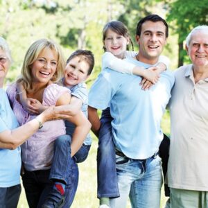 Family photo, multigenerational, grandparents, parents, grandchildren pictured in park, smiling
